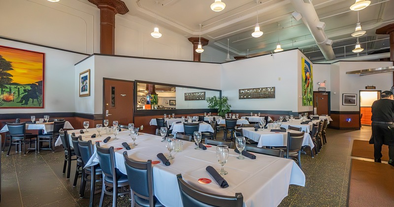 Restaurant interior, dining area with set tables