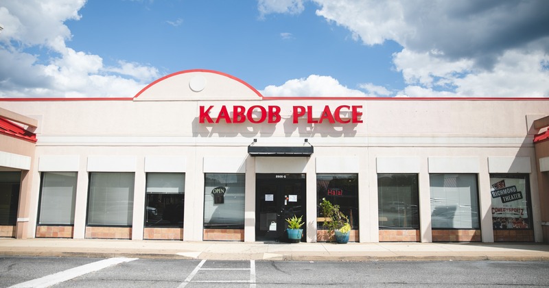 Exterior, front view to restaurant, parking lot, entrance, sign above