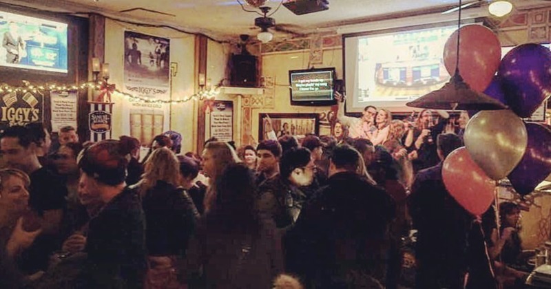 A lot of guests enjoying a night out at the bar