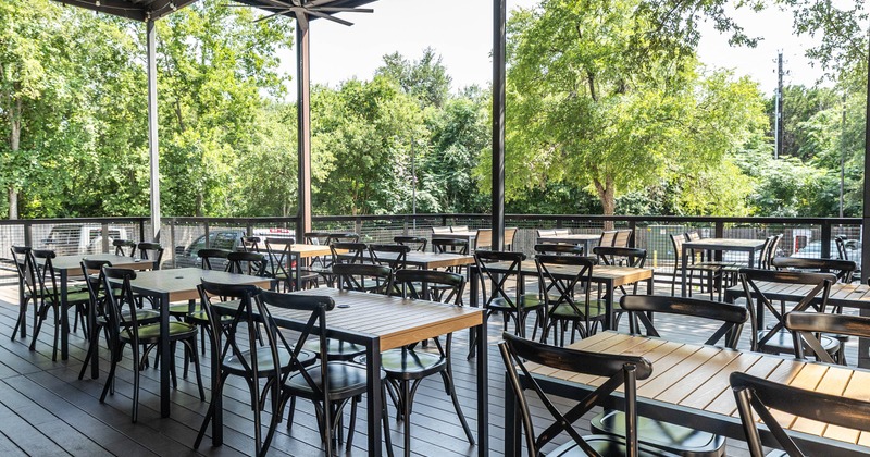 Covered patio with tables and chairs