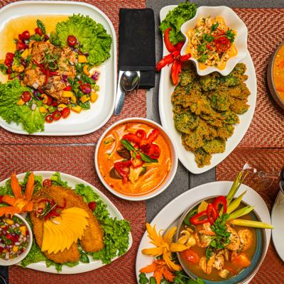 Various dishes served on the table, overhead view.
