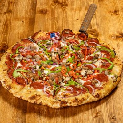 Pizza topped with pepperoni, sausage, mushrooms, onions, and bell peppers.