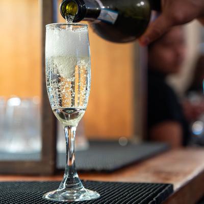 Champagne being poured into a glass.