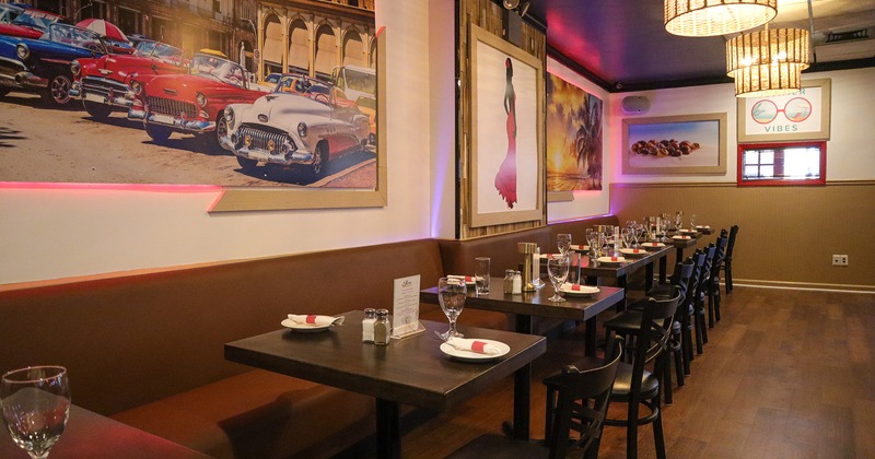 Interior, lined up dining tables for two guests