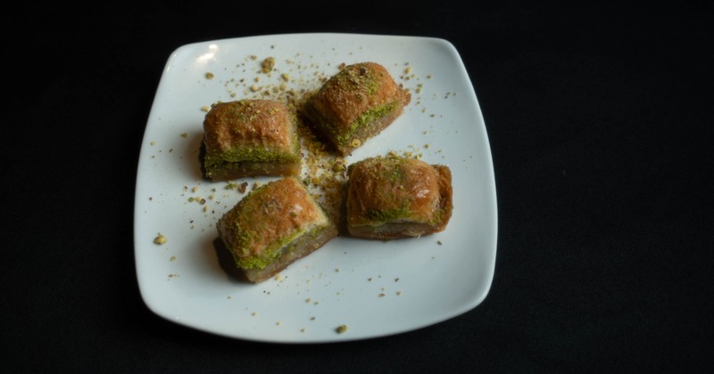Baklava pieces with crushed pistachios