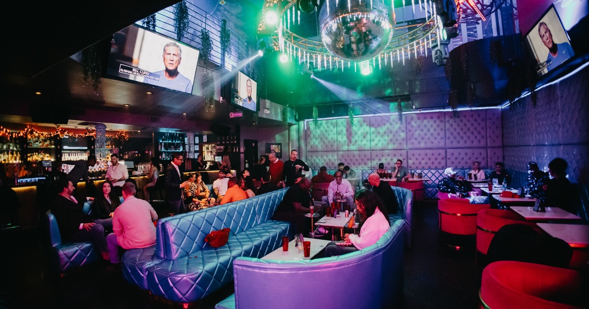 Seating space with a large disco ball hanging above