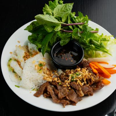 Grilled beef with vermicelli noodles, herbs, peanuts, and fish sauce.