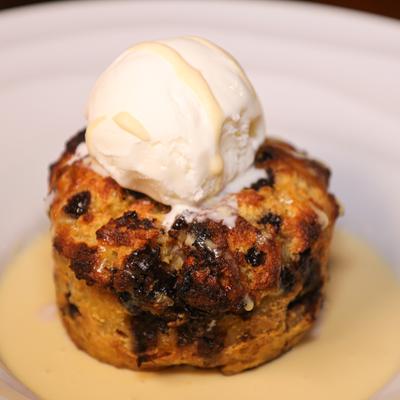 Bread pudding with chocolate chips, creme anglaise and caramel.