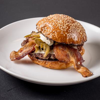 Bacon Jalapeno Burger on a toasted sesame seed bun.