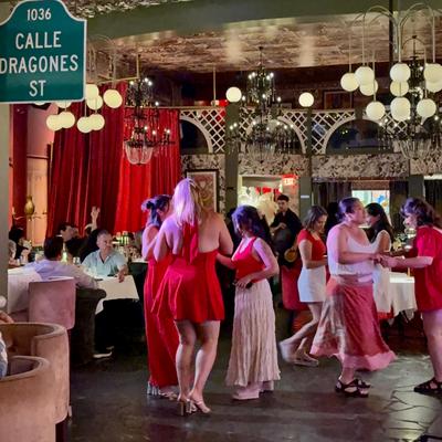 Girls in red dancing.