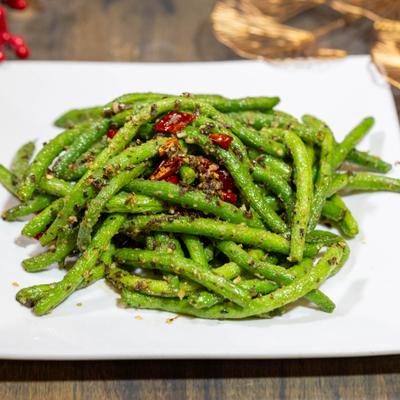 Dry-fried green beans with with garlic and red chili peppers.