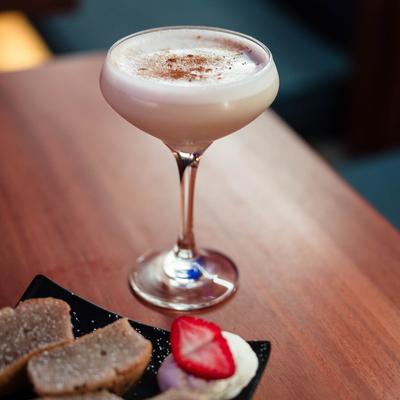 house espresso martini served with sesame mochi cakes.