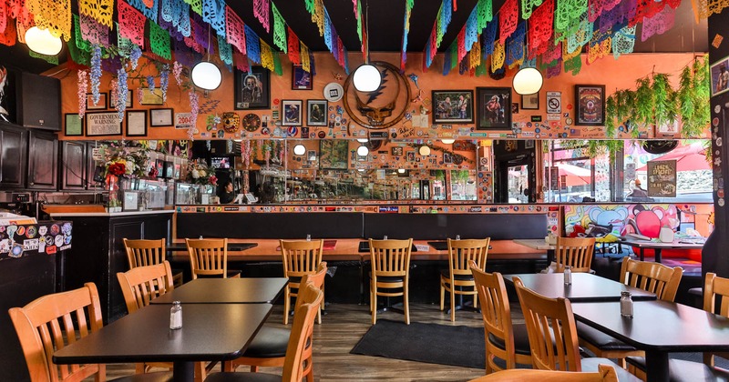 Interior, dining area, Mexican inspired decoration, picado banners, framed pictures