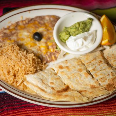 Quesadillas, with guacamole, sour cream, rice, and beans.
