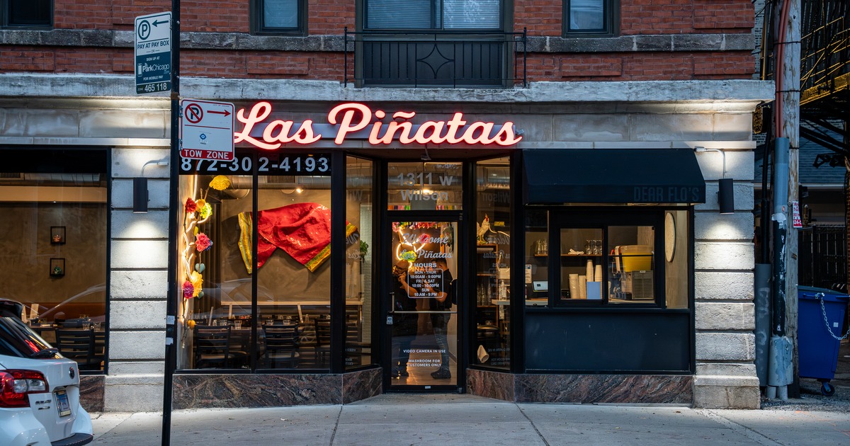 Exterior, front view to restaurant, entrance, sign above