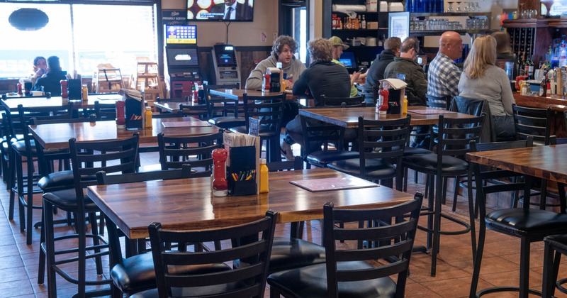 Seating area, tall tables and bar stools