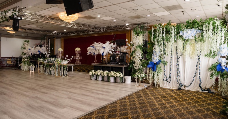 Interior, reception room decorated with flowers and a stage