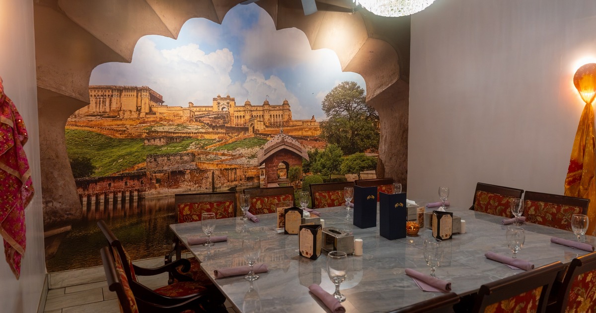 Interior, private dining space with painted panorama on the wall