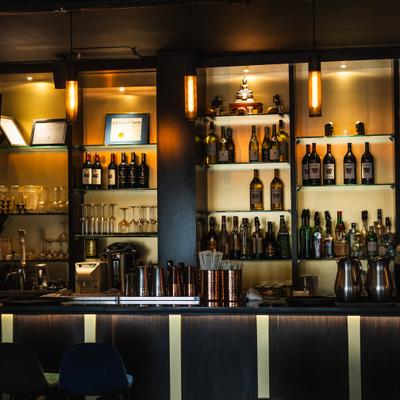 Assorted liquor bottles on the shelf.