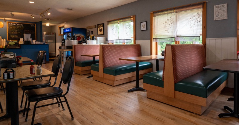 Inside, booths, dining tables, chairs