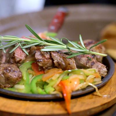 Grilled steak bites, with mixed vegetables, and rosemary.
