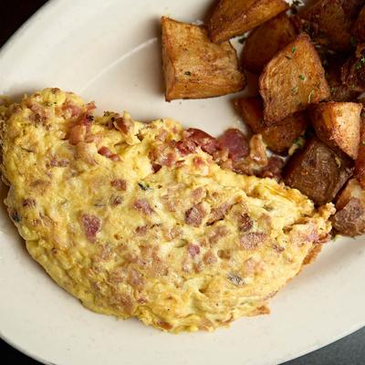 Bacon omelet with home fries.