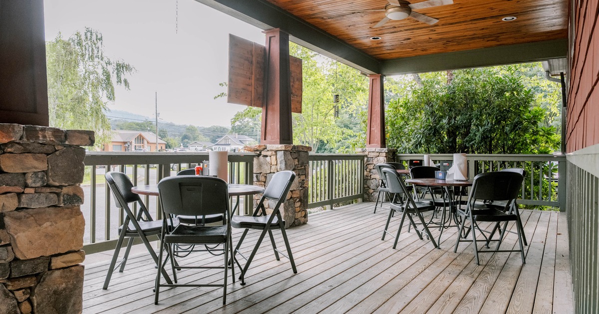 Exterior seating area with tables and chairs
