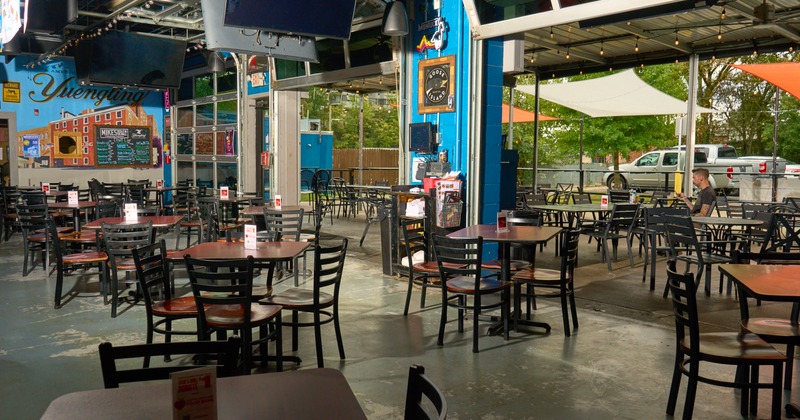 interior with wooden tables and chairs,  with TVs