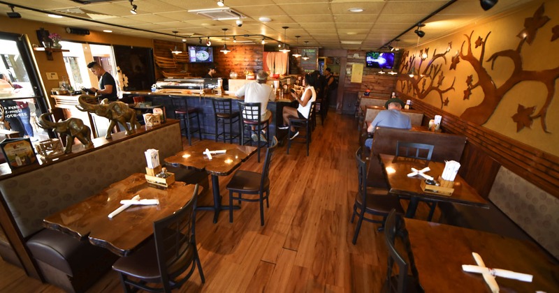 Interior, dining area, guests sitting at the bar