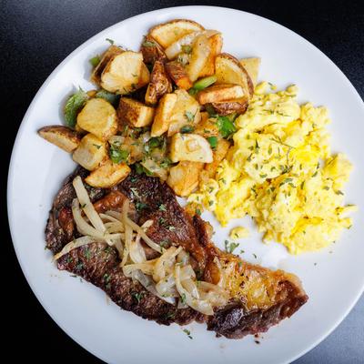 Served creamy scrambled eggs.