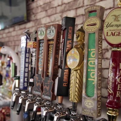 Row of draft beer taps at the bar.