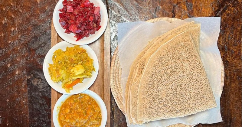 Injera with assorted vegetable sides