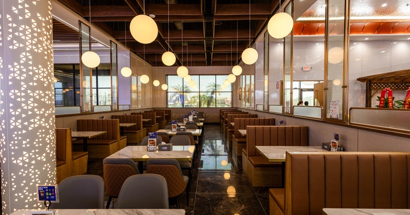Interior, tables and chairs and booths all lined up