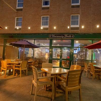 Tables and chairs outside on the patio.