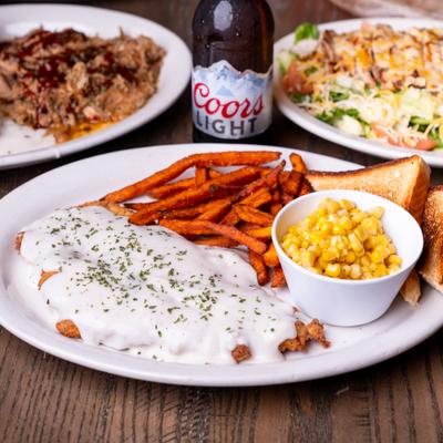 Fried chicken dinner, sweet potato fries, corn