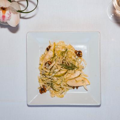 Shaved fennel and pear salad with gorgonzola cheese and caramelized walnuts.