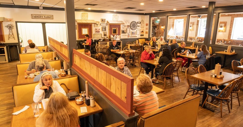 Interior, dining space with booths, tables and chairs