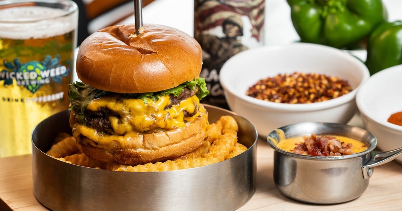 The Big Ben Burger served with fries and bacon queso