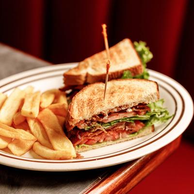 BLT sandwich served with fries.