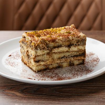 Slice of Tiramisu with pistacchio.