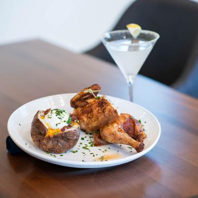 Roasted half chicken, and loaded baked potato.