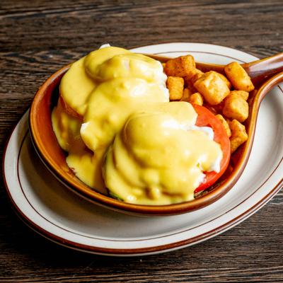 California benedict topped with hollandaise and potatoes.