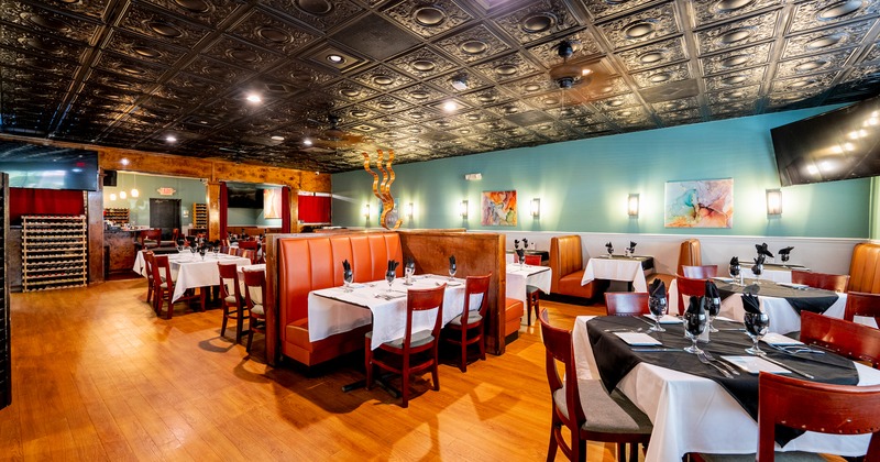 Nicely done interior dining area with set tables ready for guests