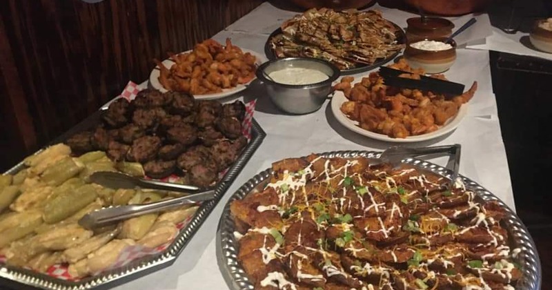Interior, lined up tables and chairs, wall decoration