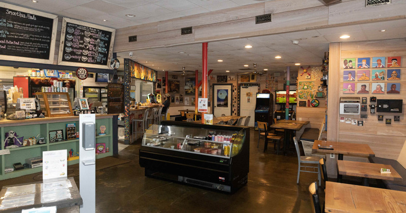 Interior, tables and fridge in the middle of the room