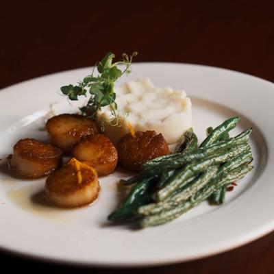 Seared scallops, with mashed potatoes and green beans.
