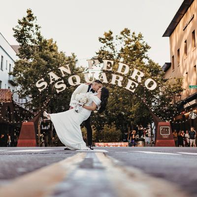 The bride and groom in an embrace outside.