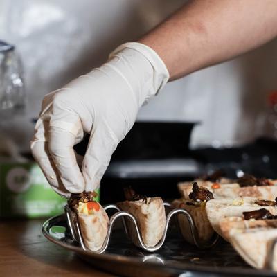 Arranging appetizer dish.