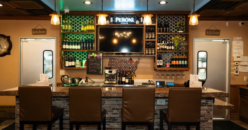 Interior, dining space with leather chairs and leather benches