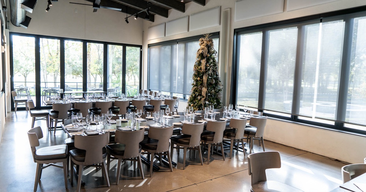 Interior, set dining tables ready to receive guests, Christmas tree decoration